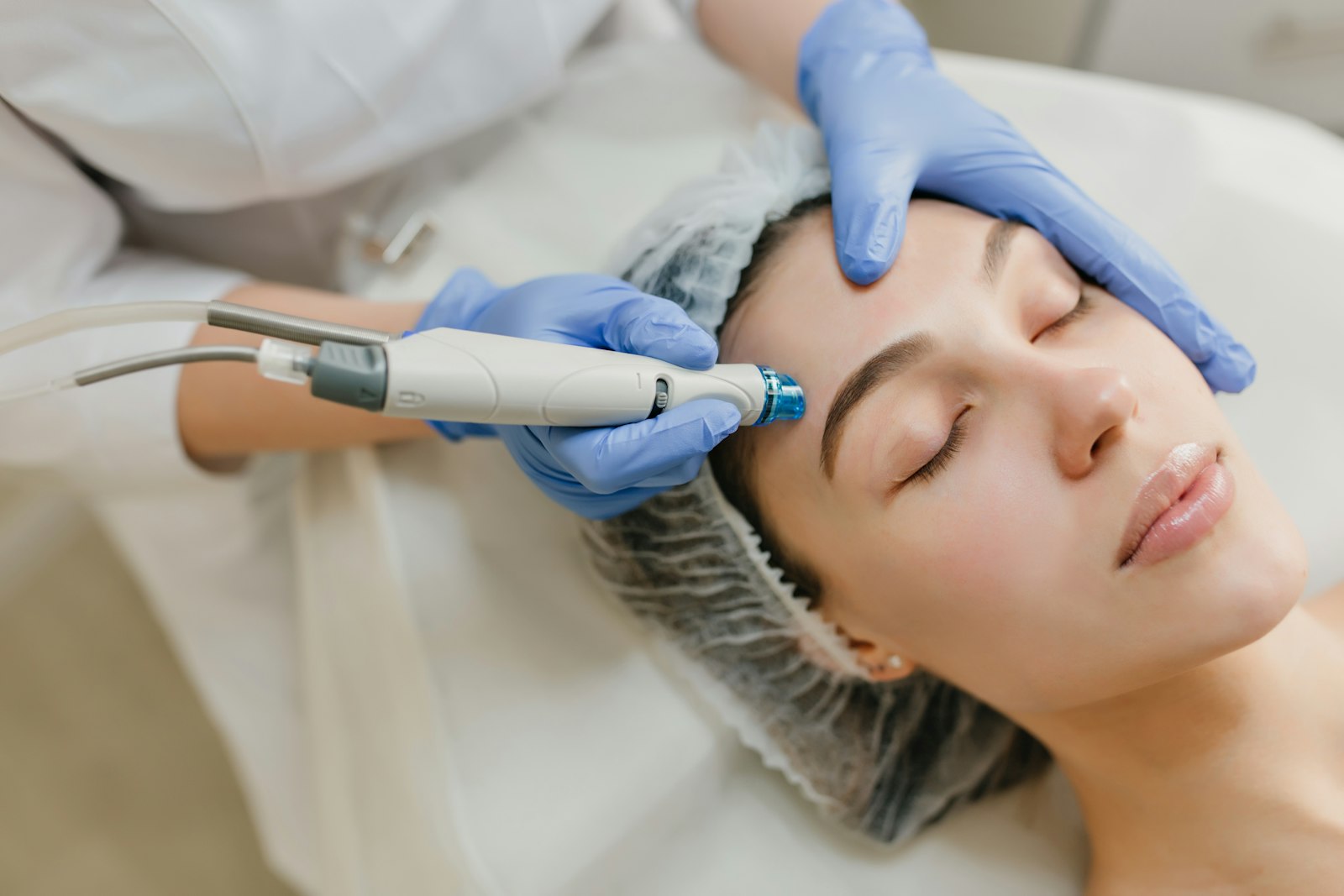 Patient receiving a hydrodermabrasion facial treatment